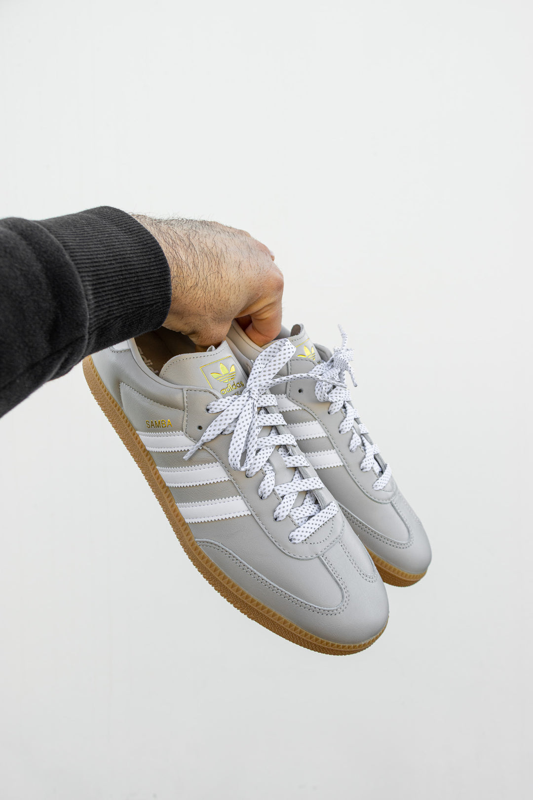 OG Adidas Samba with 45" White Reflective Flat Laces 2.0 by Lace Lab against white wall