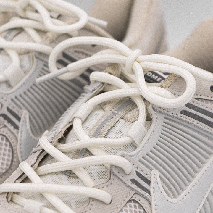 Nike Zoom Vomero 5 with Glow in the Dark Laces up close in light